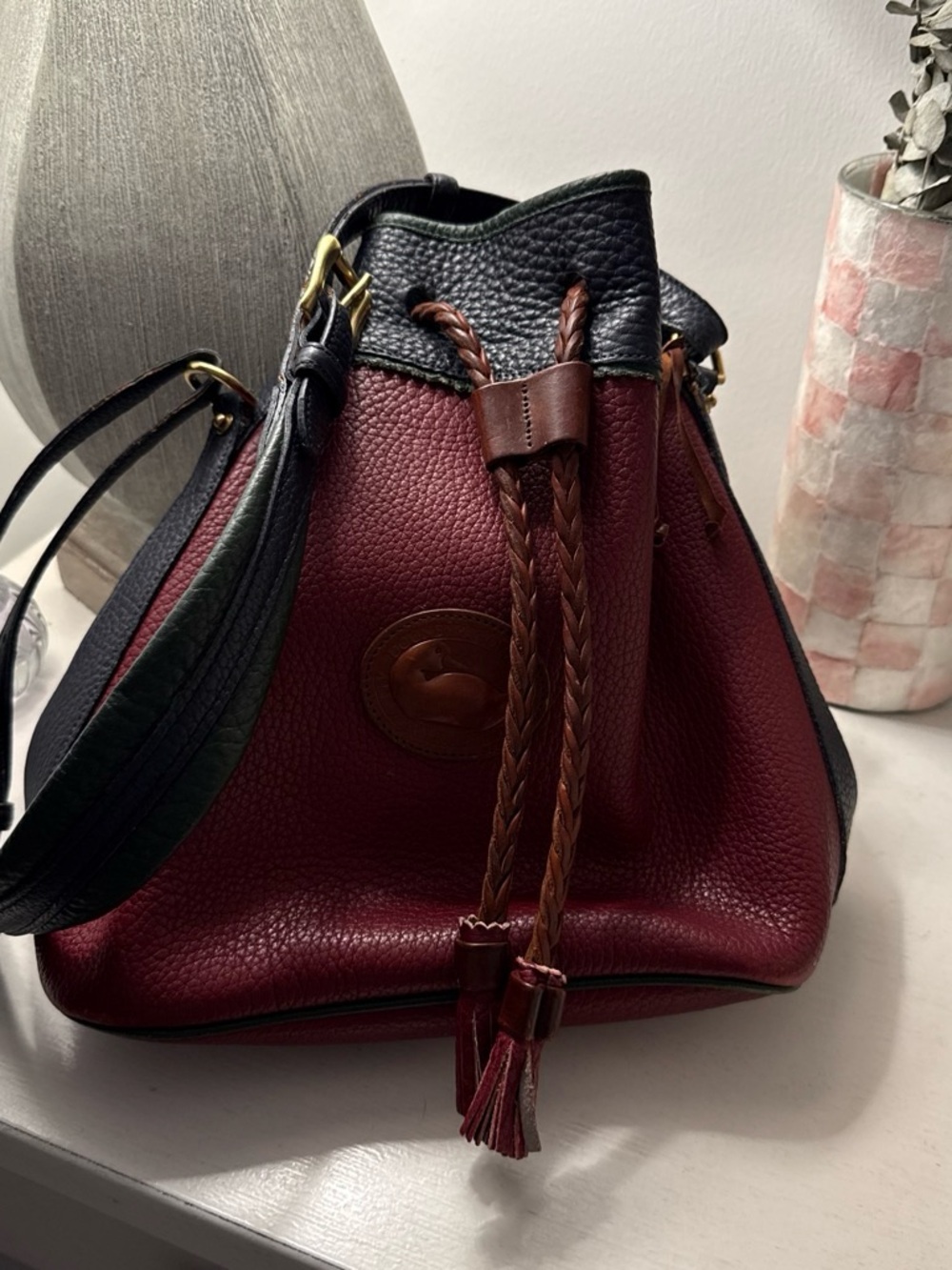 Dooney & Bourke Wine Red and Black Pebbled Leather Drawstring Shoulder Bag